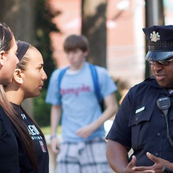 Members of Temple University's police force interact with residents